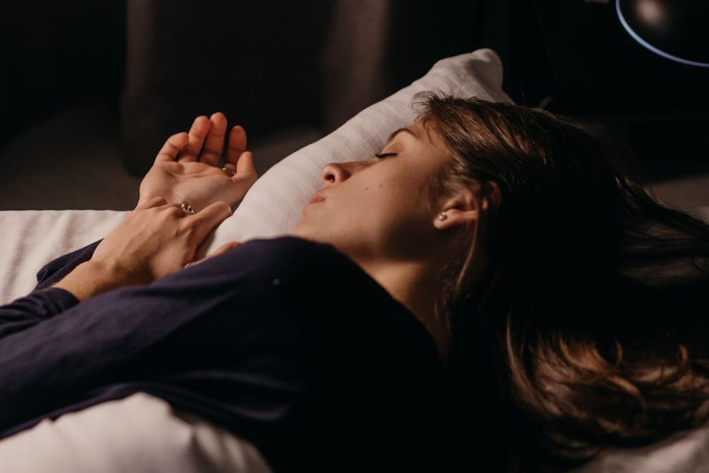 Sleeper resting in a fully darkened bedroom - illustrative category image