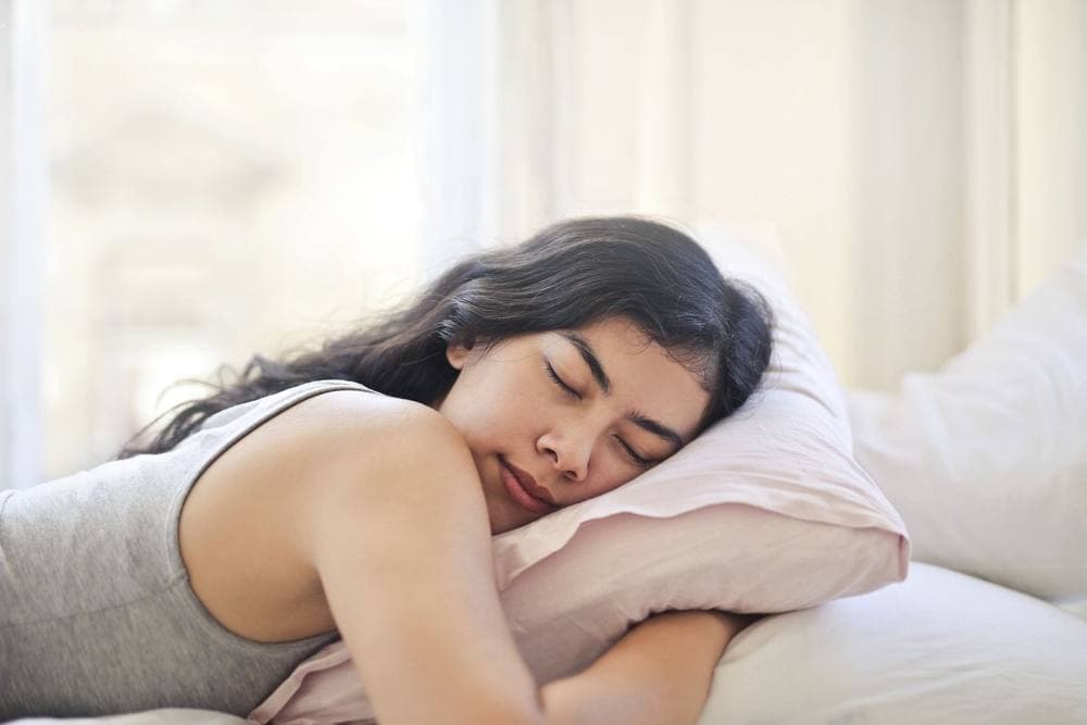 Person resting face-down on a soft pillow - illustrative category image