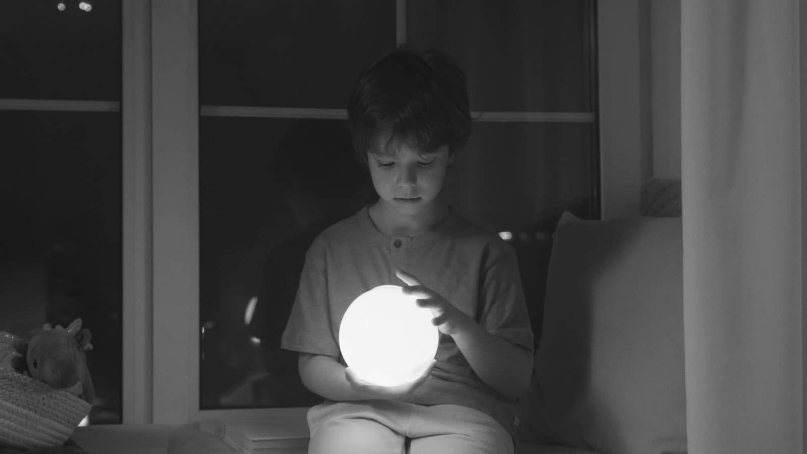 Child's bedroom at night with a soft glowing night light