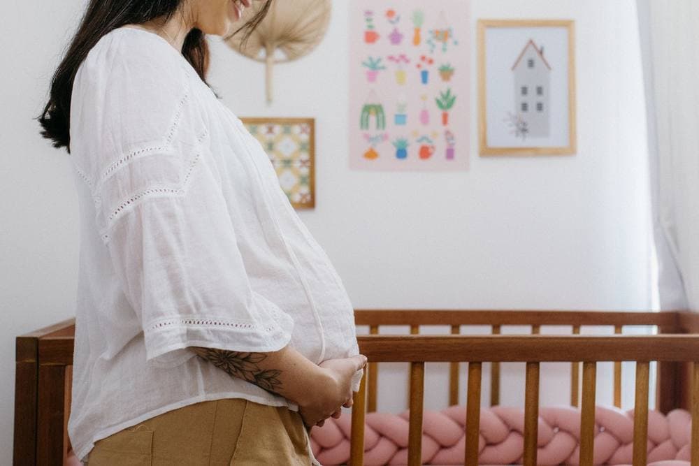 Nursery with a wooden crib and soft decor