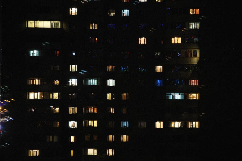Apartment building with lit windows at night