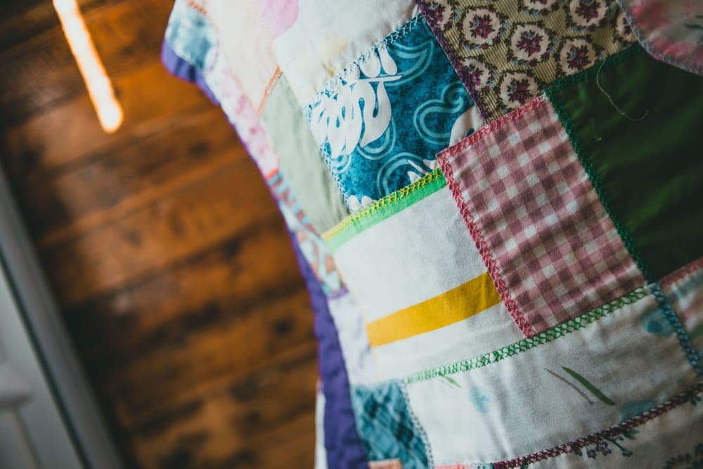 Patchwork quilt showing the stitched pockets that hold bead fill - illustrative category image